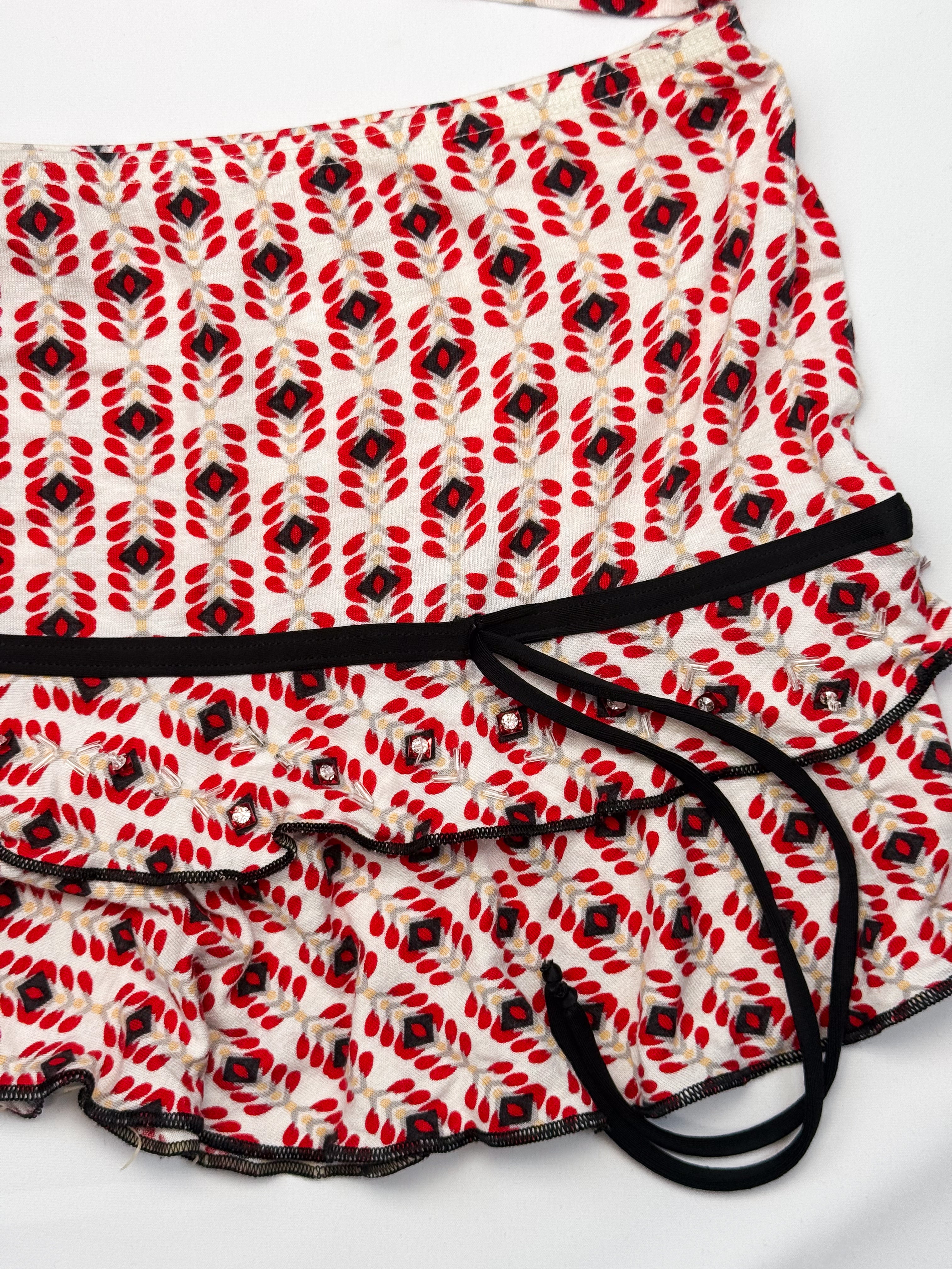 Red geometric print ruffled mini skirt with black trim, La Perla