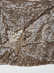 Bronze sequin wrap mini skirt with diagonal hem and sequin star
