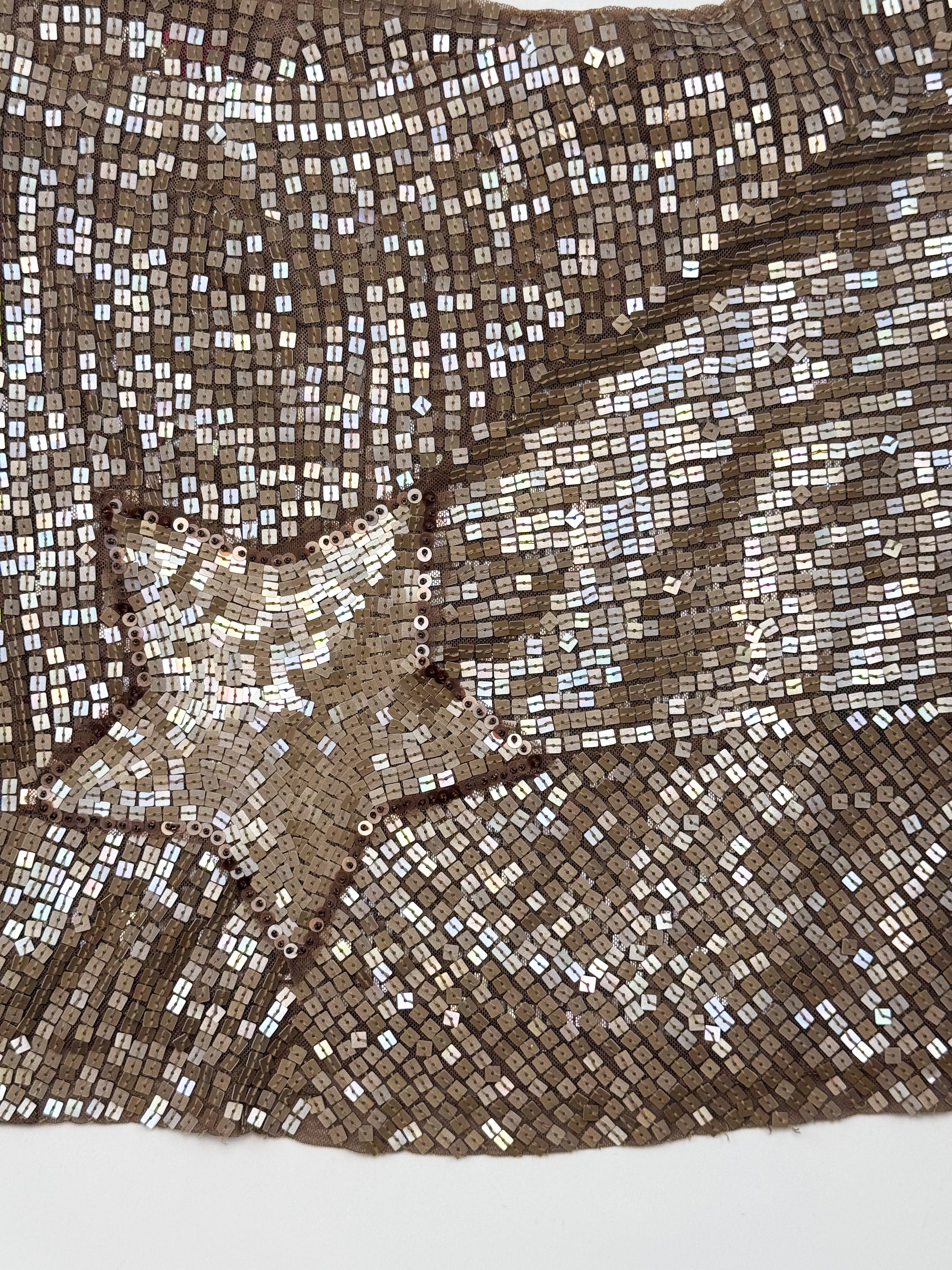 Bronze sequin wrap mini skirt with diagonal hem and sequin star