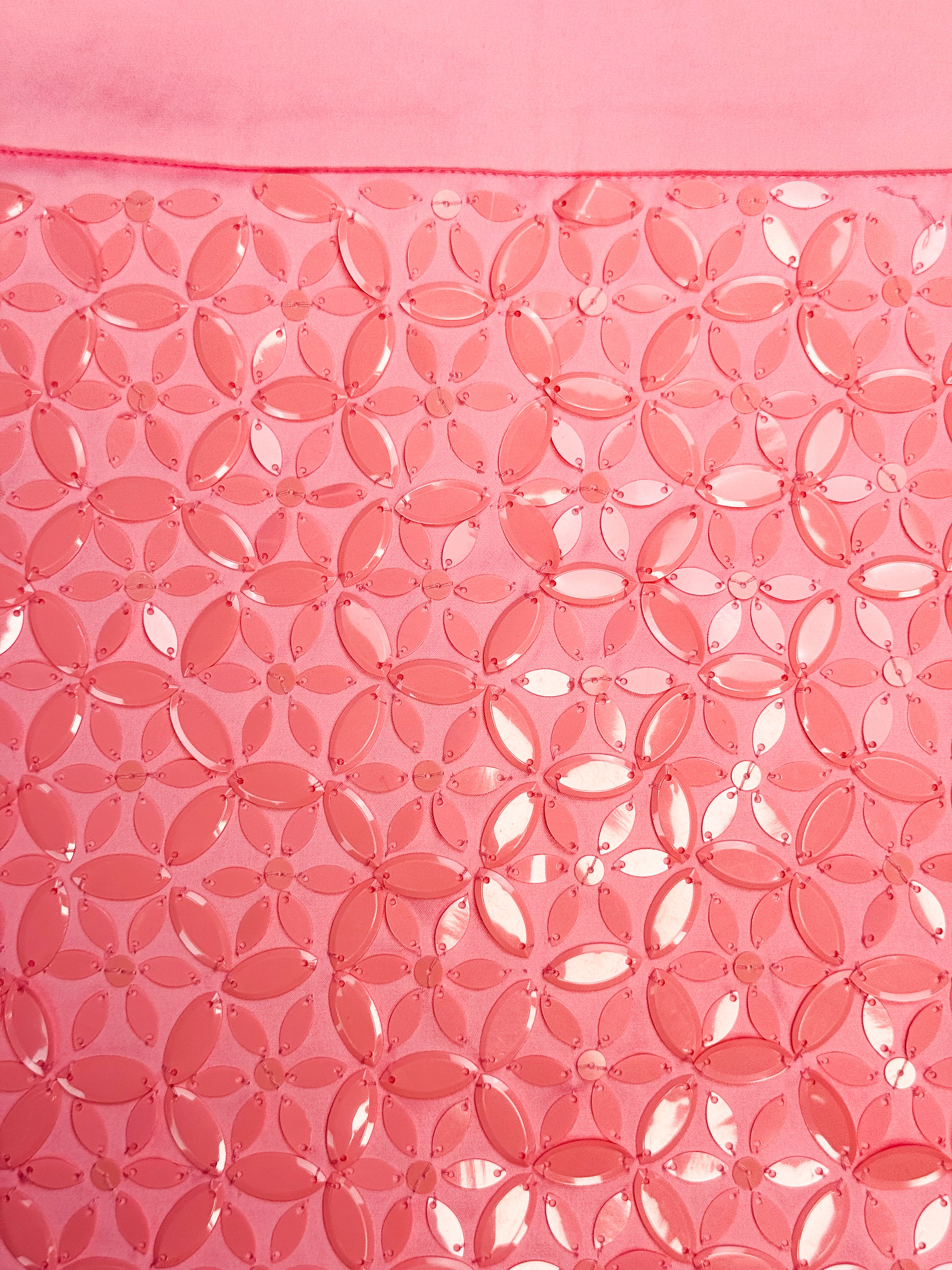 Coral pink Specchio mini skirt with four-petal floral paillette pattern