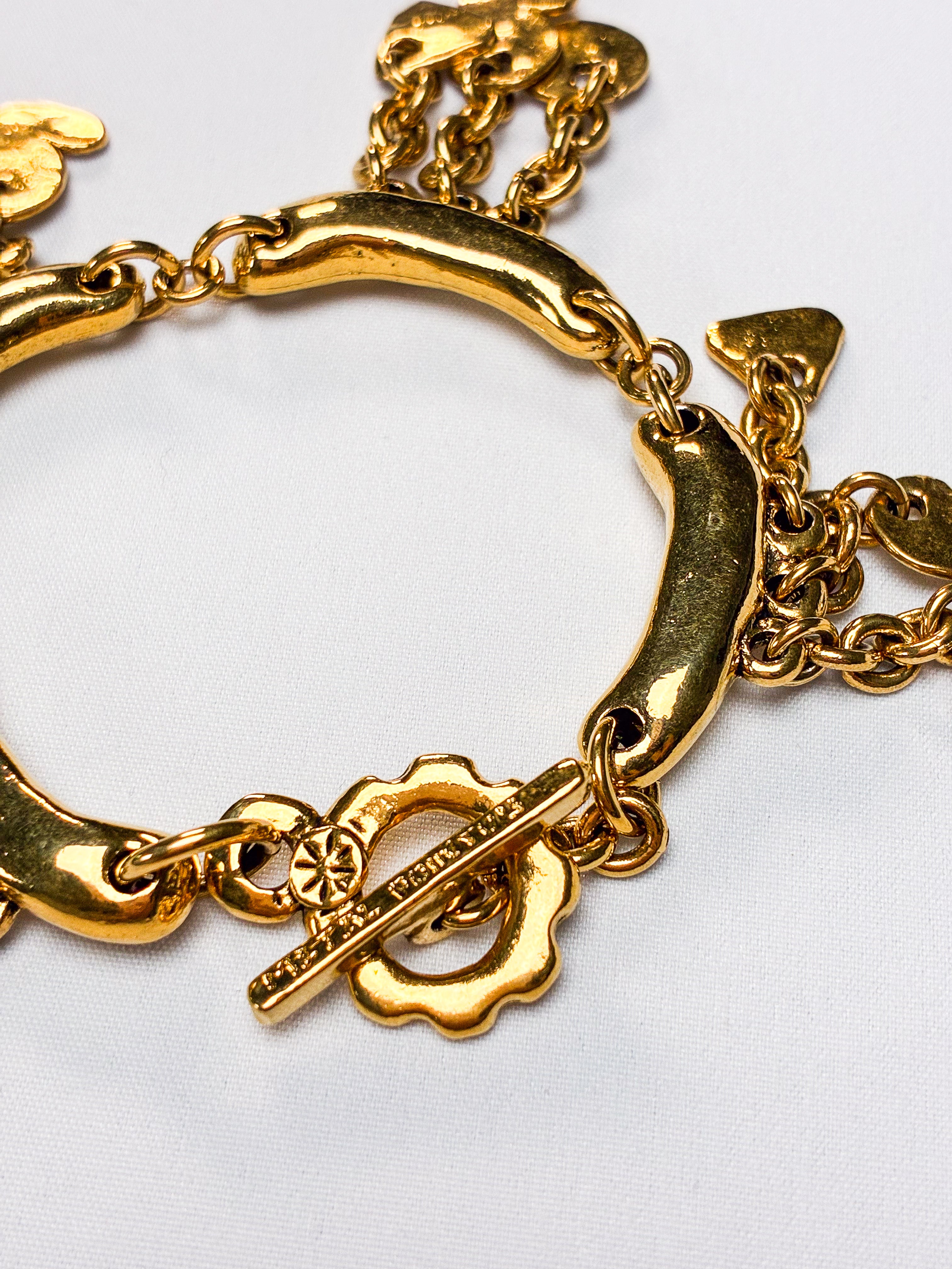 Metal Pointu's Paris 1990s Gold-Tone Bar & Charm Bracelet
