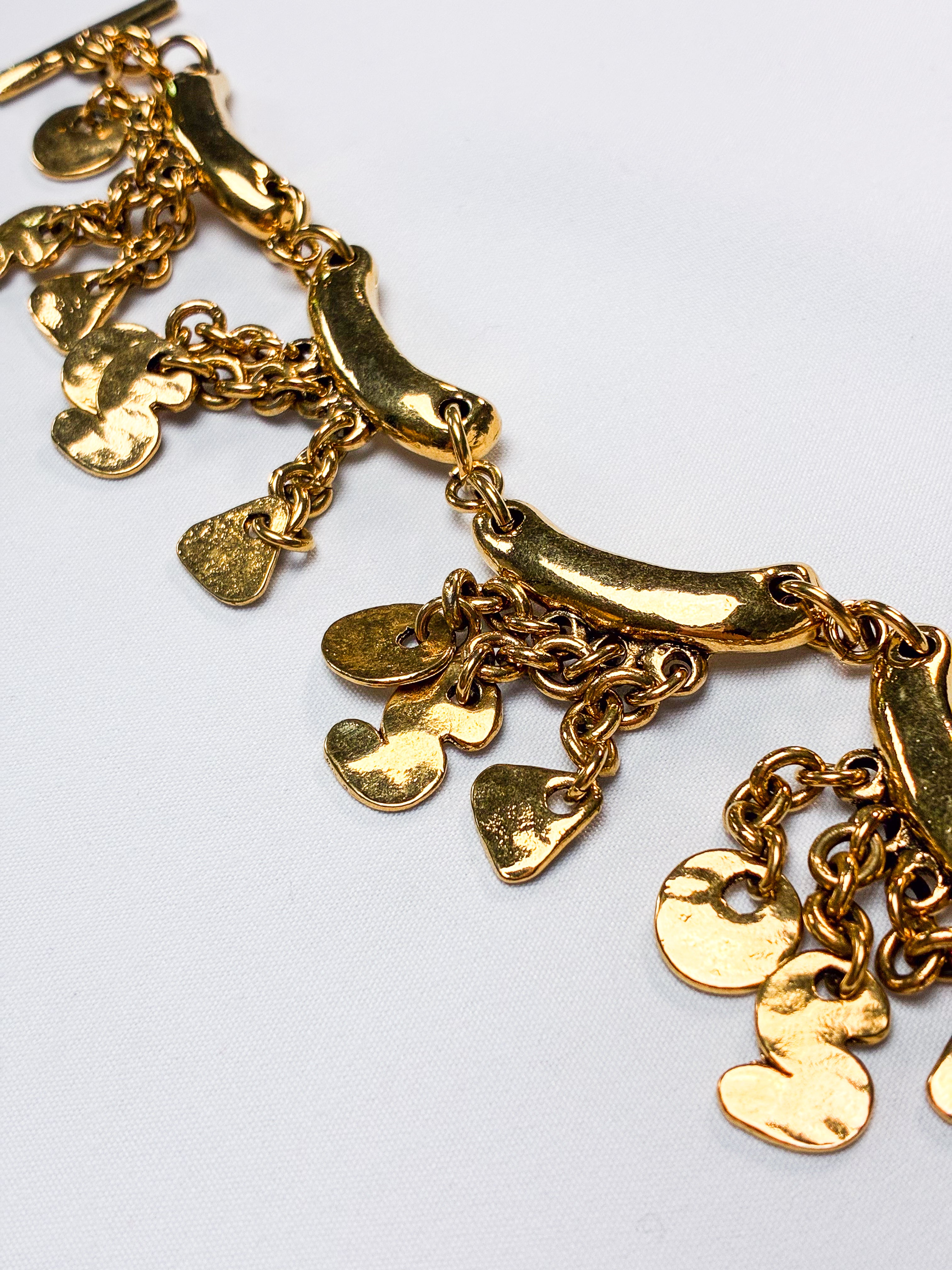 Metal Pointu's Paris 1990s Gold-Tone Bar & Charm Bracelet