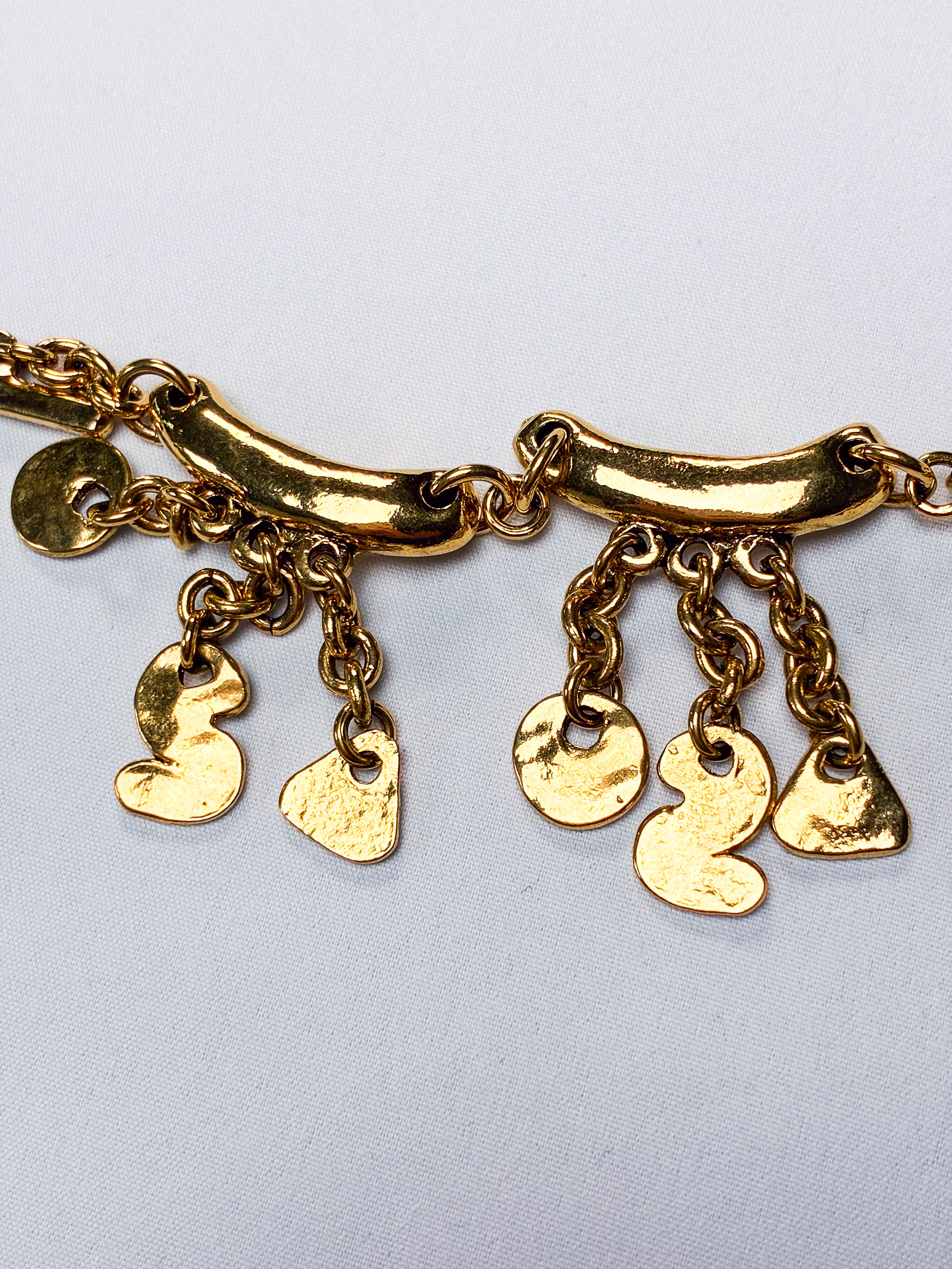 Metal Pointu's Paris 1990s Gold-Tone Bar & Charm Bracelet