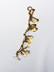 Metal Pointu's Paris 1990s Gold-Tone Bar & Charm Bracelet