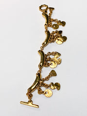 Metal Pointu's Paris 1990s Gold-Tone Bar & Charm Bracelet