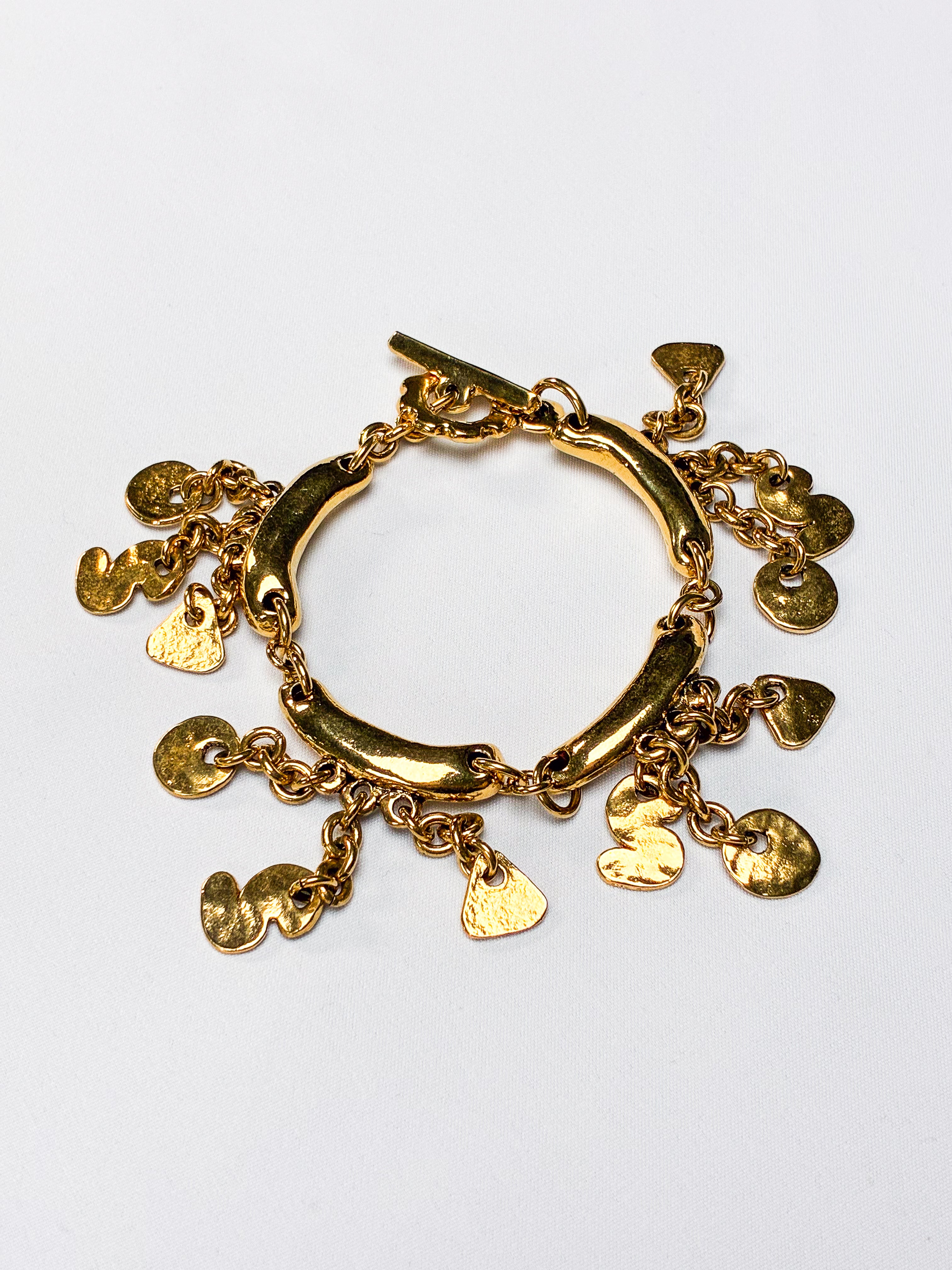 Metal Pointu's Paris 1990s Gold-Tone Bar & Charm Bracelet